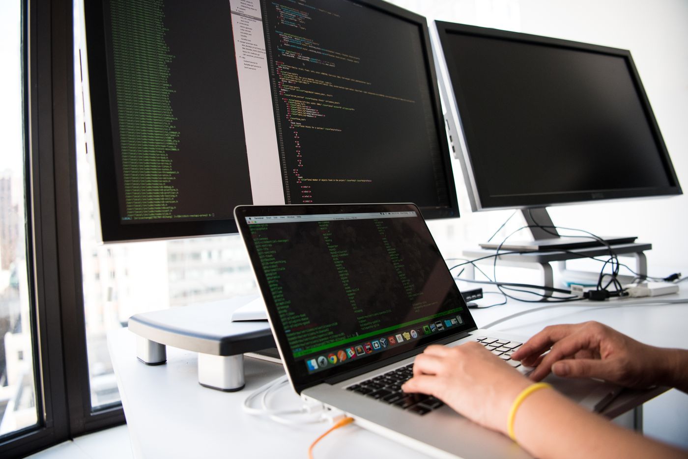 Software developers working together at their desks